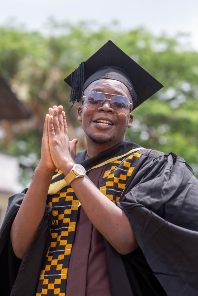 About A picture of Ephraim Oracca-Tetteh in a Graduation gown.
